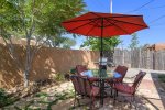 Private back patio with dining for four